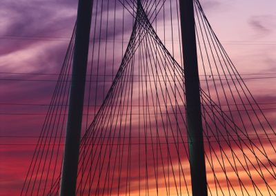 1341 Margaret Hunt Hill Bridge by Santiago Calatrava, dramatic dusk light, arch, cables & power lines detail, Dallas, TX (vertical)