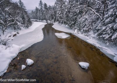 07408 Snow-lined Swift River after a winter blizzard in the White Mountains of New Hampshire