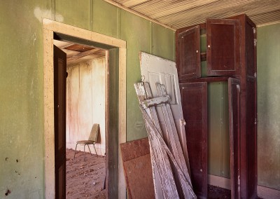 1421 Green chair in abandoned house, Texas Hill Country
